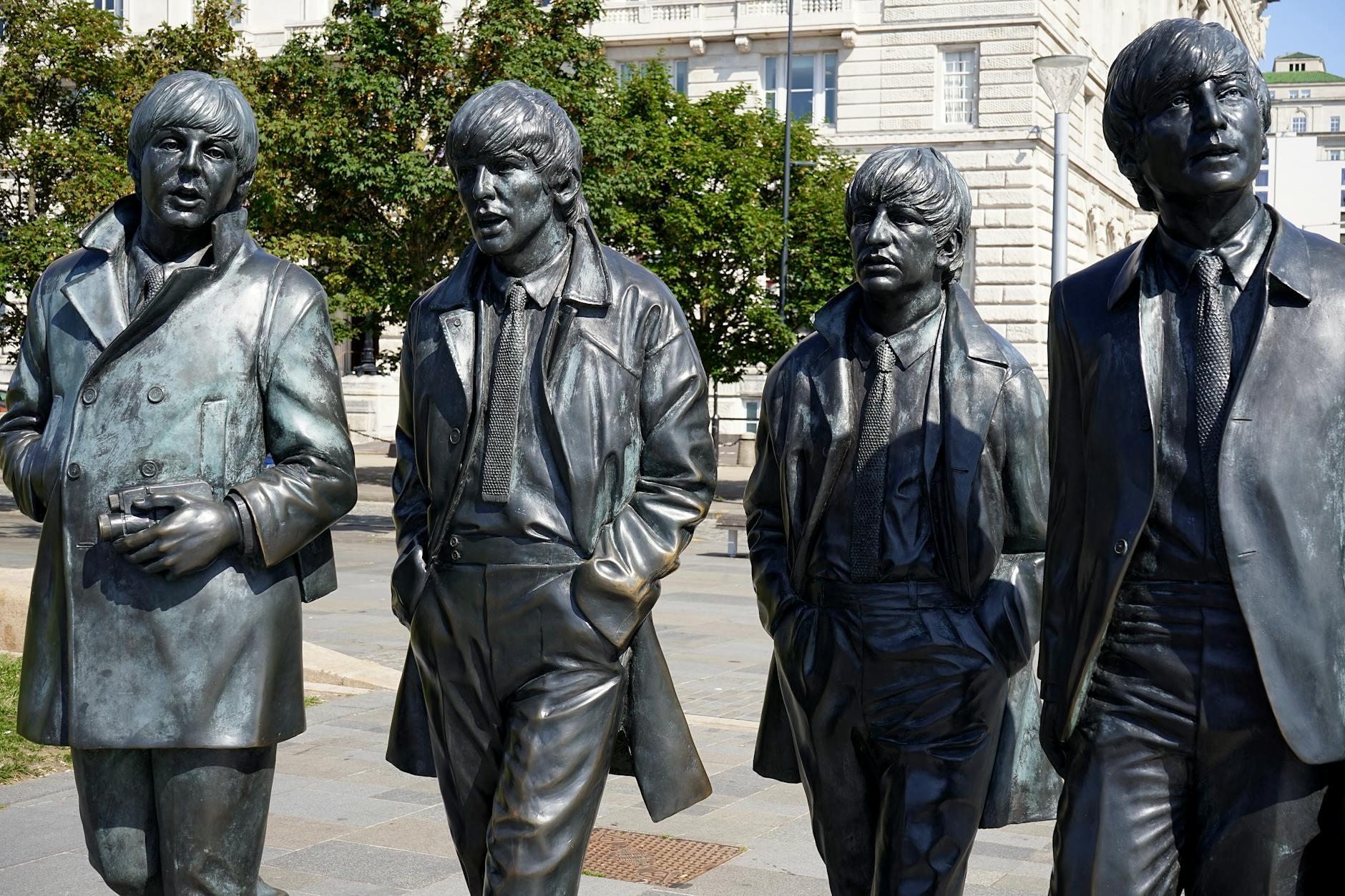 The Complete Beatles Liverpool Guide 1 The Beatles statue on Liverpool's Pier Head waterfront, a bronze sculpture of John, Paul, George, and Ringo walking together