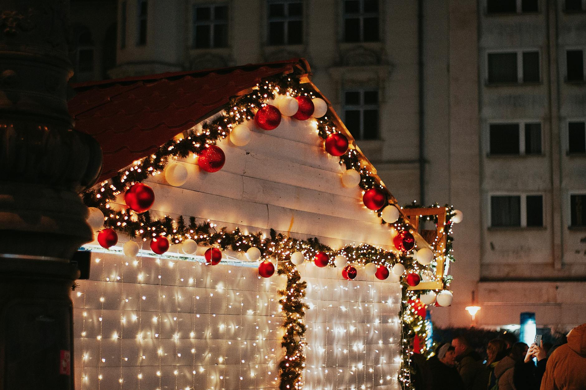Festive Christmas market stalls with twinkling lights, similar to Liverpool's annual Christmas market at St George's Plateau