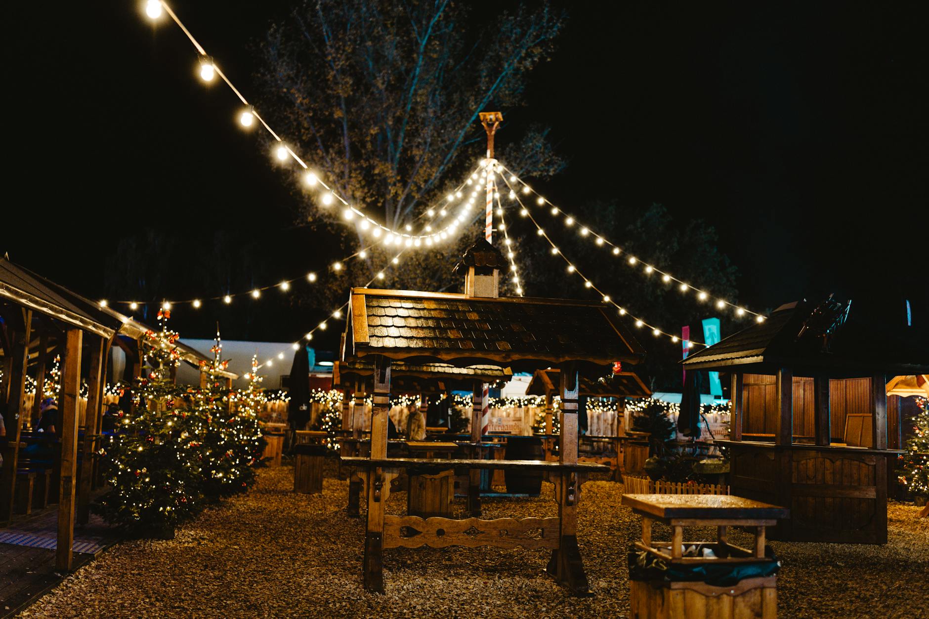 Liverpool Shopping Guide: Markets, Malls & Independent Shops 5 Traditional wooden market stalls at Liverpool's Christmas markets, offering handcrafted gifts, festive food, and seasonal decorations