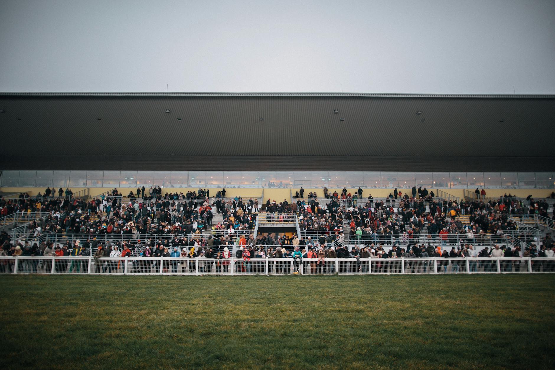Spectators at a horse racing event, capturing the excitement of the Grand National at Aintree near Liverpool