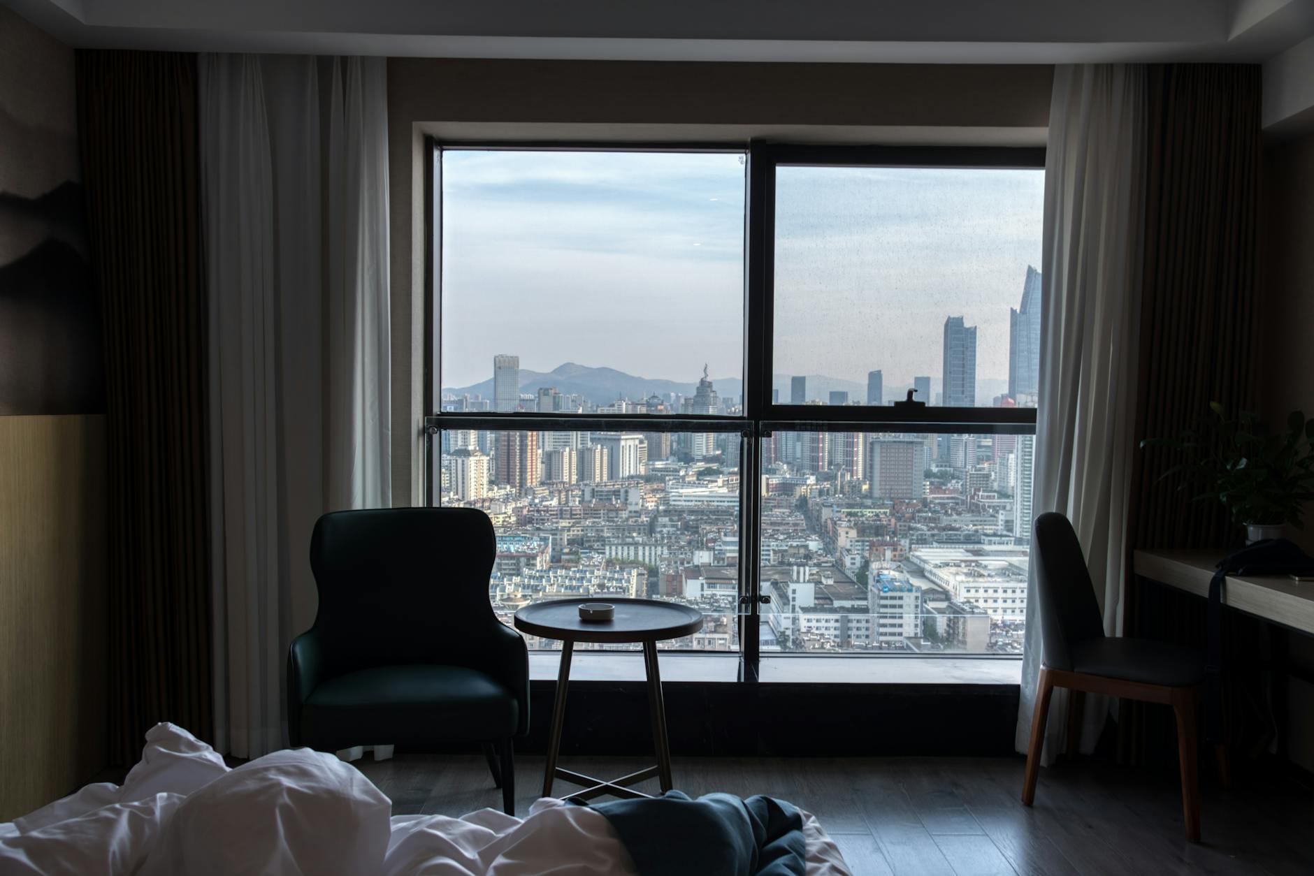 A stylish luxury hotel room in Liverpool city centre with modern furnishings and city views