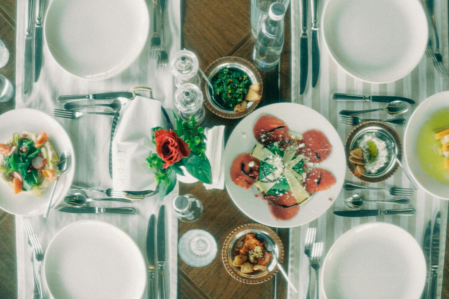 Liverpool Food & Dining Guide: Where to Eat 3 An elegant restaurant table setting in Liverpool, showcasing the city's thriving fine dining scene