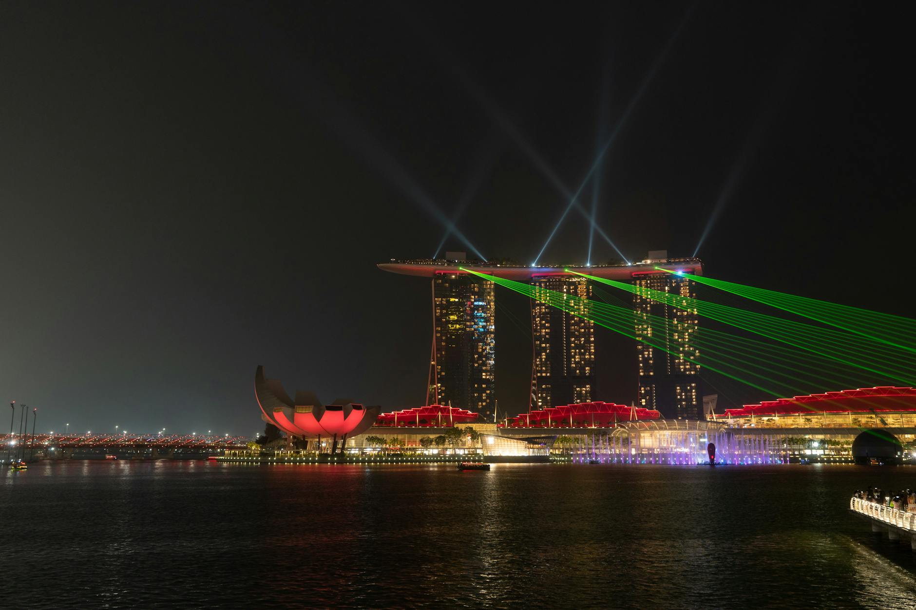 A spectacular waterfront light installation at night, similar to Liverpool's River of Light festival