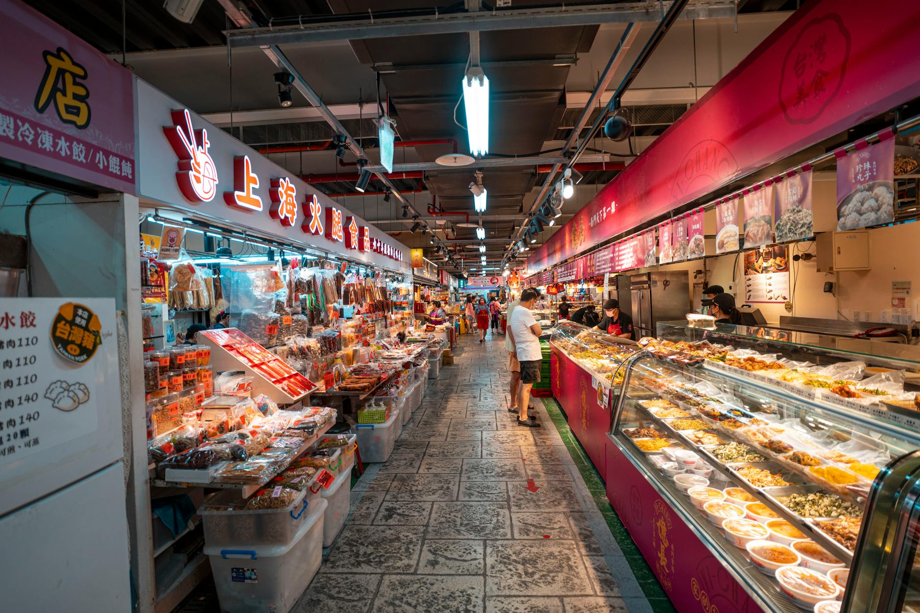 Liverpool Food & Dining Guide: Where to Eat 4 A bustling indoor street food market with diverse food stalls and vendors, similar to Liverpool's Baltic Market