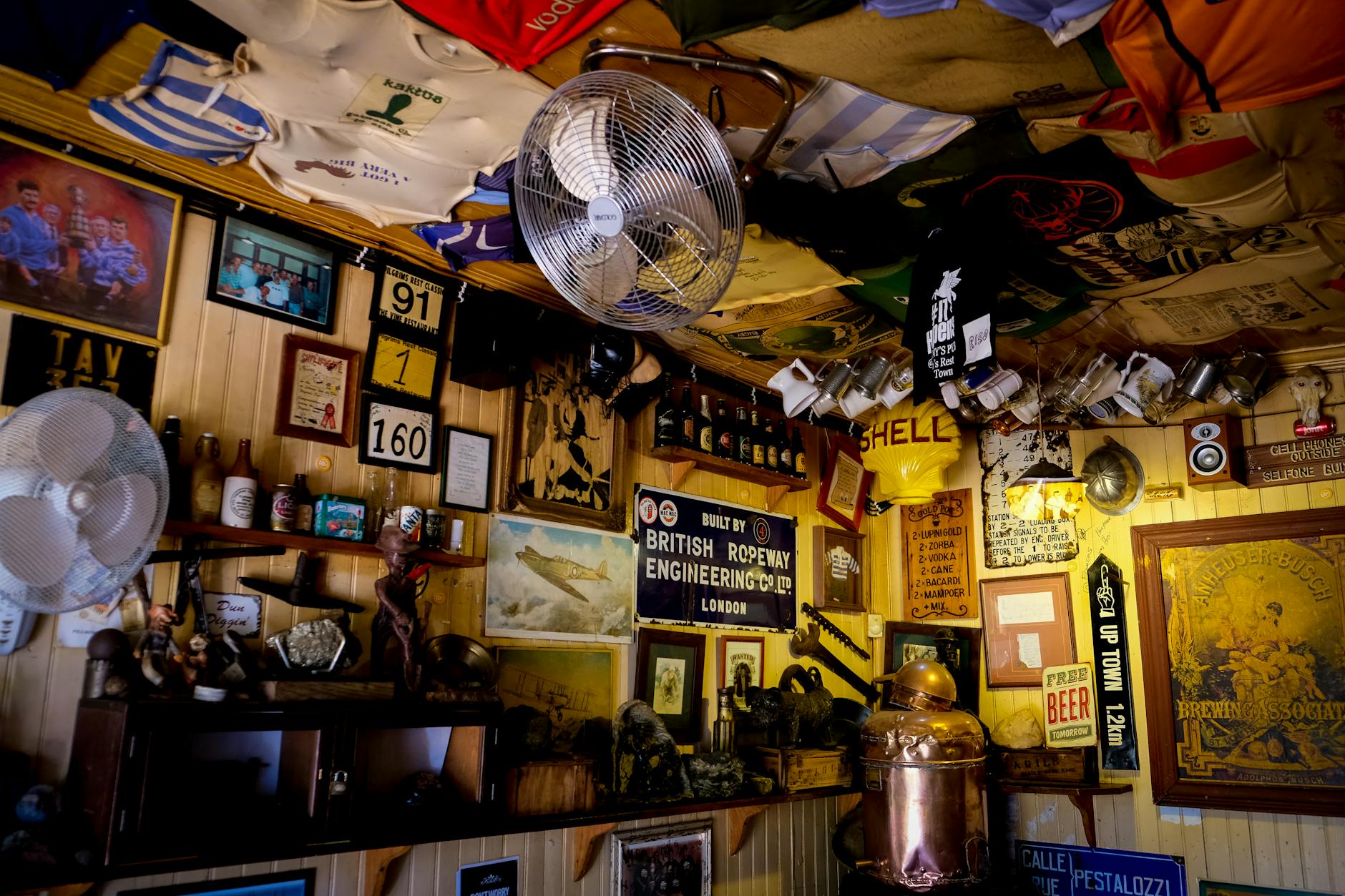Liverpool Food & Dining Guide: Where to Eat 2 The ornate interior of a traditional British pub in Liverpool, with Victorian-era features and warm atmosphere