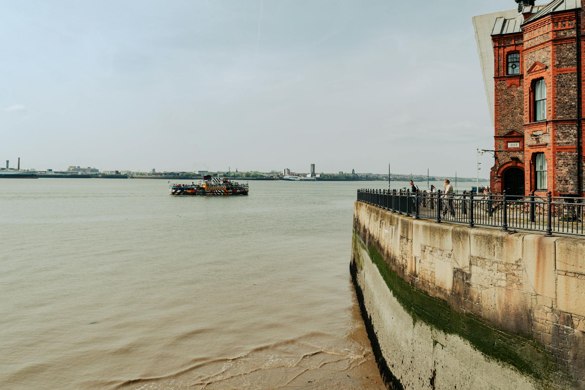 Liverpool with Kids: The Ultimate Family Guide 2 The Mersey Ferry crossing the River Mersey in Liverpool, a classic family activity with panoramic waterfront views