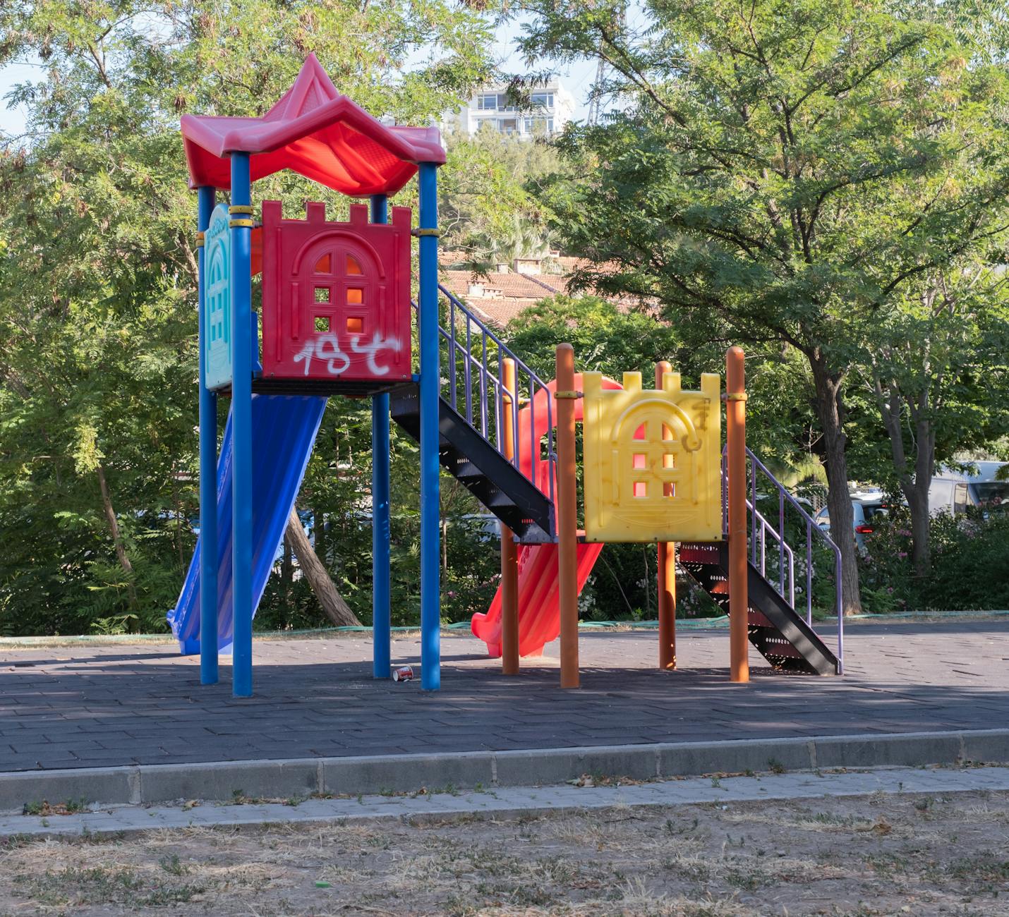 Liverpool with Kids: The Ultimate Family Guide 3 Children playing in an adventure playground at Sefton Park, Liverpool's largest and most beautiful urban park