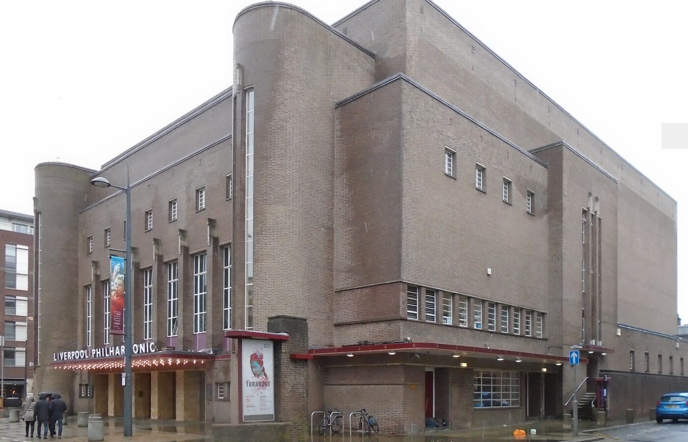 Liverpool Philharmonic Hall & the Royal Liverpool Philharmonic 4 The brown-brick Art Deco exterior of Liverpool Philharmonic Hall on Hope Street, with rounded corner towers, tall narrow windows and the Liverpool Philharmonic name over the canopy