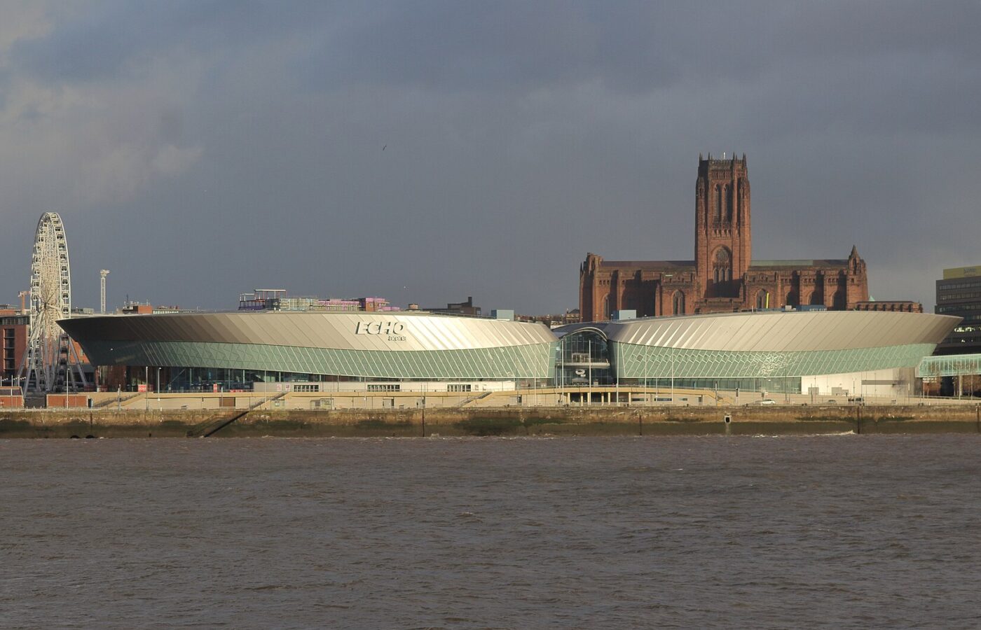 M&S Bank Arena Liverpool: Seating Plan, Getting There & Tips 4 The arena and convention centre complex at Kings Dock in Liverpool seen from the Mersey with the Anglican Cathedral behind