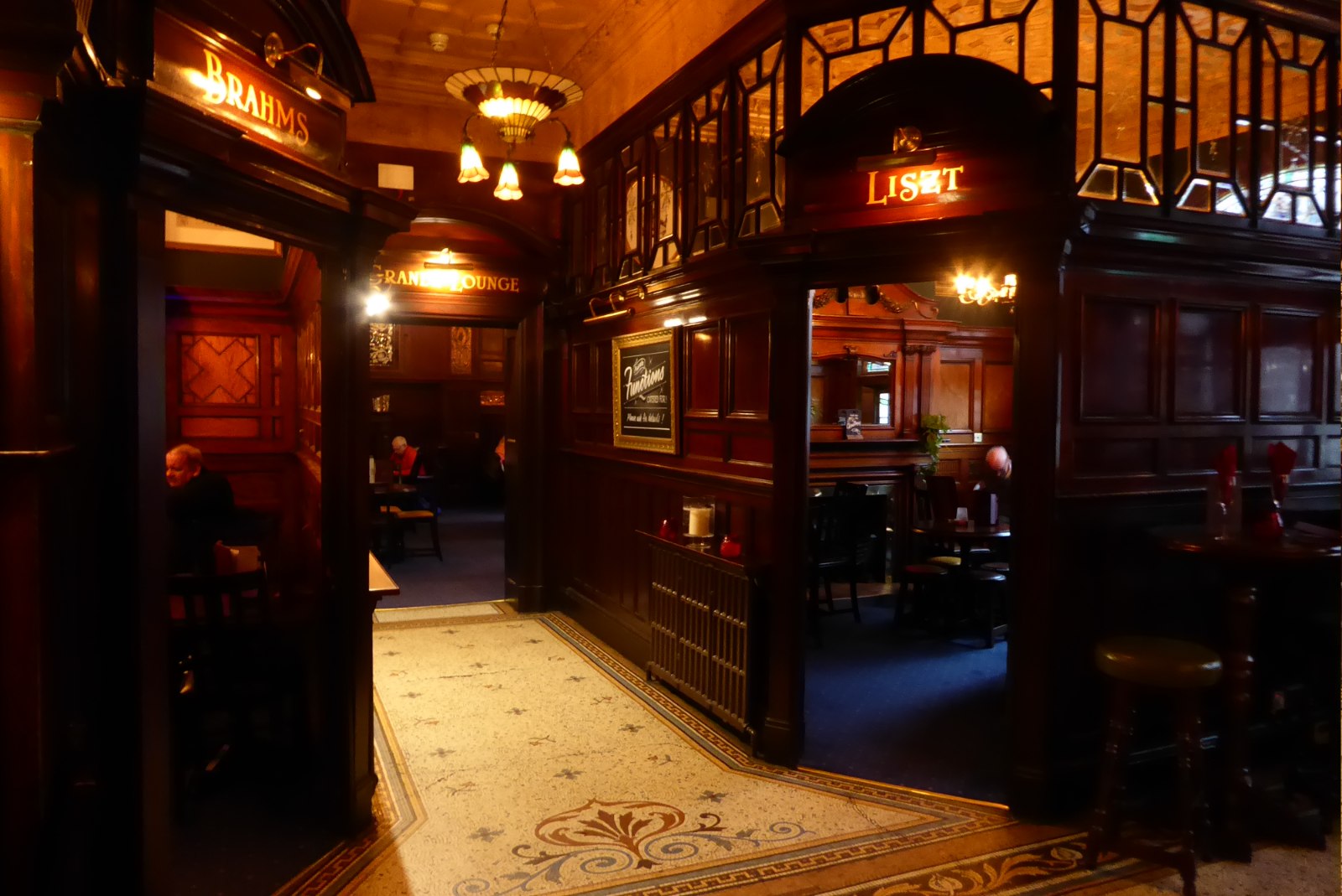 Georgian Quarter Liverpool: Hope Street, Cathedrals & Terraces 3 The mahogany and stained glass interior of the Philharmonic Dining Rooms in Liverpool with mosaic floor and snug doorways