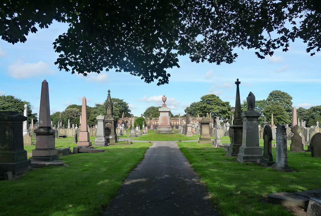 Anfield, Everton & North Liverpool: What's There Beyond the Stadiums 4 A straight path through Anfield Cemetery lined with Victorian obelisks, crosses and headstones on green lawns, with trees and a tall monument at the far end